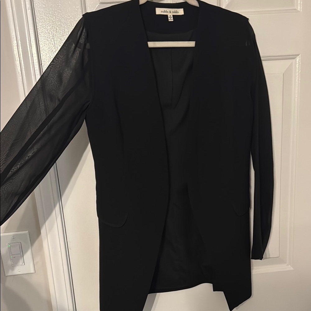 Black long blazer with sheer sleeves and faux pocket detailing.